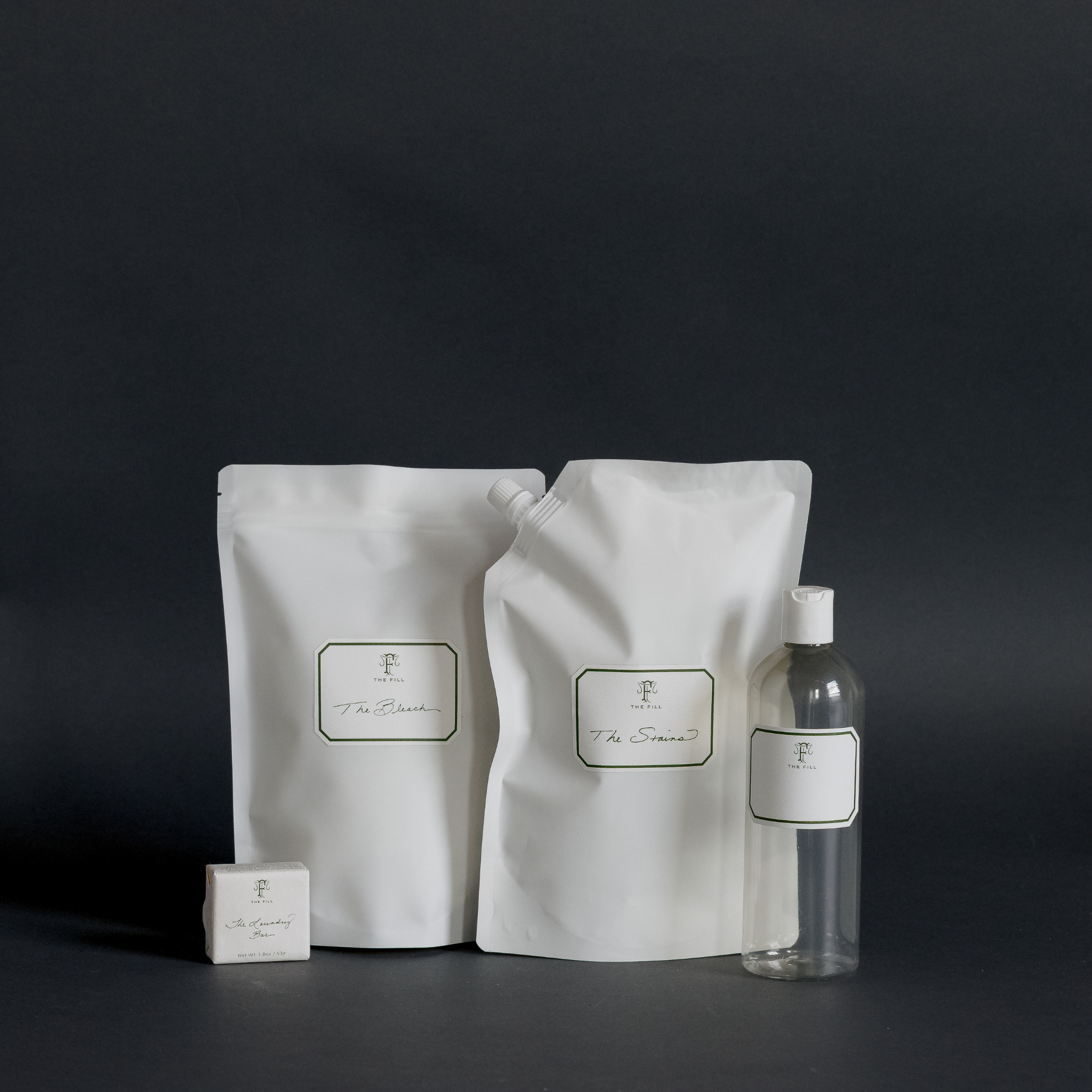 The Stains Set from The Fill includes The Stains, The Bleach, The Laundry Bar and a 16oz Plastic Bottle with Cap
